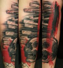polka trash skull and keyboard tattoo by Kevin Riley at Studio One Tattoo Norwood PA Philadelphia